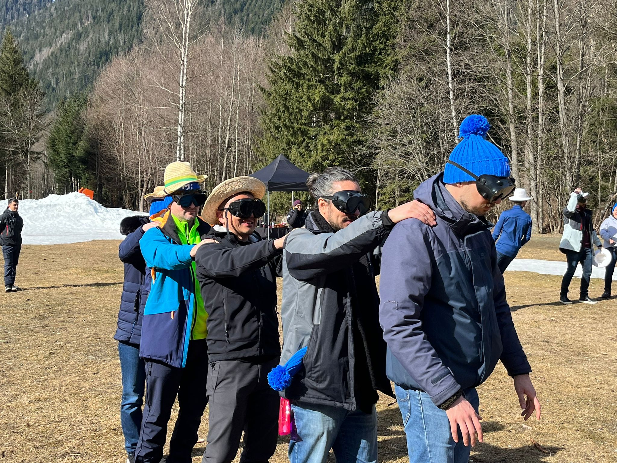 Members of the MUI team standing in a line with their arms extended on each others' shoulders.